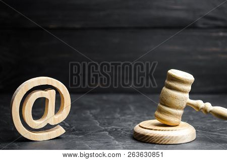 Judge's Hammer And Email Address. The Concept Of Legal Proceedings For The Seizure Of Rights To Use 