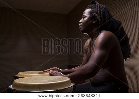 Young African Man Plays Congas