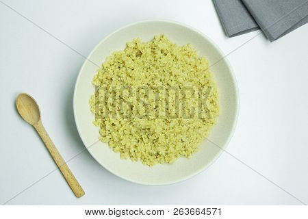 Cooked Quinoa In White Ceramic Bowl On White Background