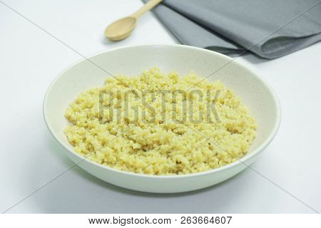 Cooked Quinoa In White Ceramic Bowl On White Background