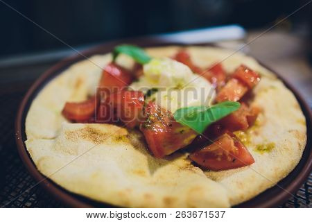 Turkish And Arabic Traditional Ramadan Pide With Egg On Top. Wood Background. Pizza Margherita Is A 