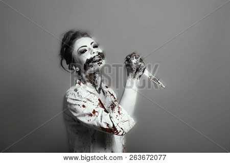 Scary Damaged Girl In Nurce Halloween Costume Looking Like Zombie On Yellow Background