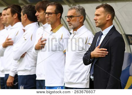 Lviv, Ukraine - September 9, 2018: Ukrainian Coaches And Bench Players Listen To The National Anthem
