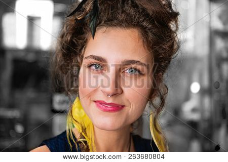Beautiful Cheerful Dark-haired Woman With Blue Eyes Smiling Broadly Feeling Happy