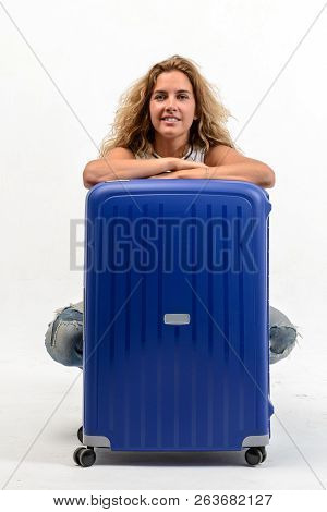Beautiful Young Blonde Woman With Blue Plastic Suitcase On White Background