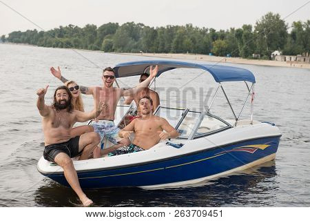 Company Of Freinds Are Swimming On The Boat On The Riiver