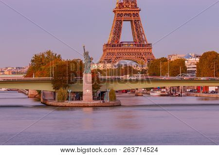 Swan Island, Statue Of Liberty, Eiffel Tower At Sunset. Paris. France