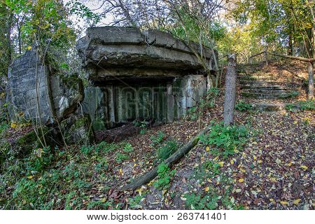 Demolished Bunker In Central Europe. Old Reinforced Concrete Fortifications Of The Pomeranian Embank