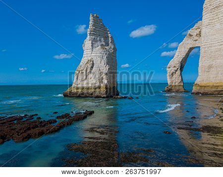Chalk Cliffs Of Etretat With The Natural Arch Porte Daval And The Stone Needle Called Laiguille