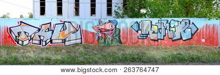 Full And Acomplished Graffiti Artwork. The Old Wall Decorated With Paint Stains In The Style Of Stre