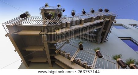 Stairs With Potted Plants Against A Blue Sky