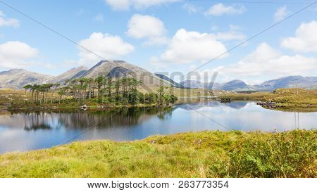 A Mountainous Landscape Reflected In Derryclare Lough, In The Inagh Valley, County Galway, Ireland.
