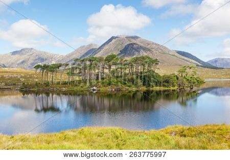 A Mountainous Landscape Reflected In Derryclare Lough, In The Inagh Valley, County Galway, Ireland.