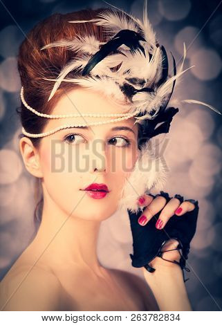 Redhead Girl With Rococo Hair Style At Vintage Background. Photo In Old Style.