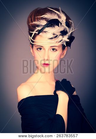 Redhead Girl With Rococo Hair Style At Vintage Background. Photo In Old Style.