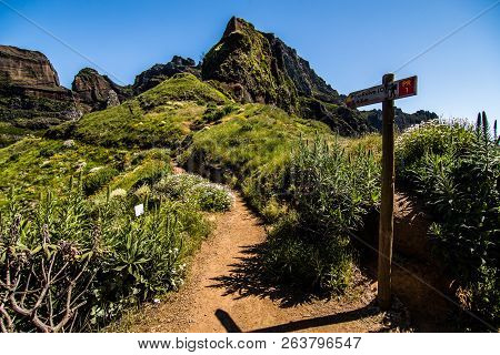 Wooden Road Sigh Pointing Pico Ruivo At The Highest Walking Path Of Madeira Island.