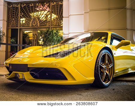 Macau - November 12, 2014: Yellow Ferrari 458 Spider Parked In Front Of Casino Entrance