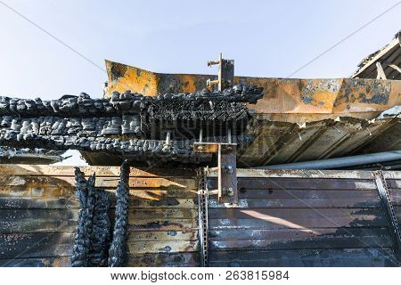 Damaged Industry Supermarket After Arson Fire With Burn Debris Of Twisted Metal Wood Structure After