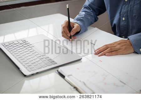 Business And Finance Investment Concept : Businessman Check About Cost And Doing Finance Graph Repor