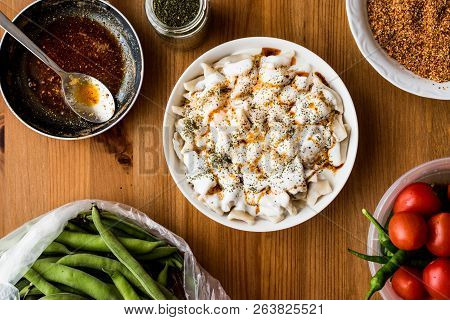 Turkish Manti Manlama / Ravioli With Yogurt And Fried Butter Sauce.