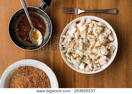 Turkish Manti Manlama / Ravioli With Yogurt And Fried Butter Sauce.