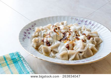 Turkish Manti Manlama / Ravioli With Yogurt And Fried Butter Sauce.