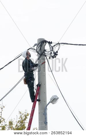Athens, Acharnes, Stratopaido Kapota/ Greece - October 18 2018: Electrician technician worker cut ca