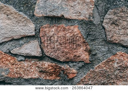 An Irregular Stone Wall With Different Stones In Closeup