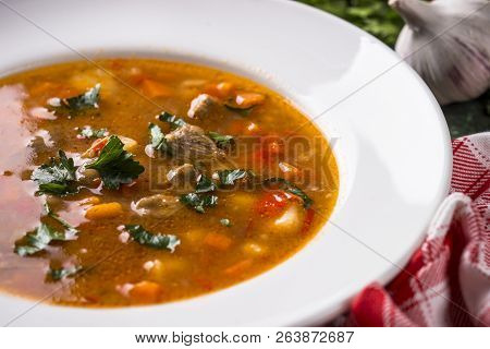 Traditional Hungarian Goulash Soup On The Table. European Cuisine.