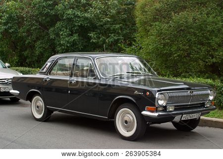 Saint Petersburg, Russia - August 25, 2018: Black Volga Gaz-24 Parked In The City Center. Side View-