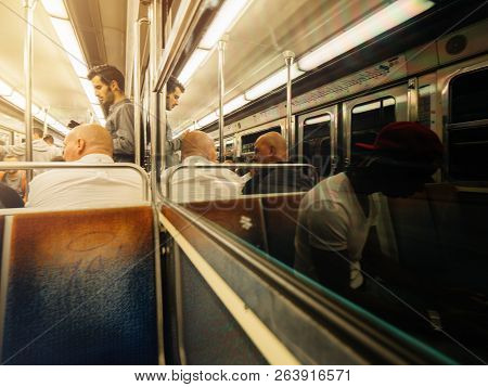 Paris, France - Oct 13, 2018: Black Ethnicity Man Young People Commuting Inside The Traditional Rer 
