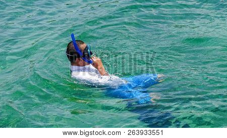 Labuan,malaysia-sept 22,2018:man Enjoying Snorkeling In Tropical Lagoon Of Rusukan Kecil Island At L