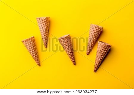 Cone For Ice Creame On Yellow Background. Topv View. Minimalistic Concept