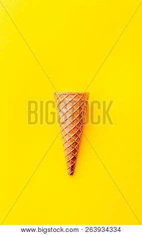 Cone For Ice Creame On Yellow Background. Topv View. Minimalistic Concept