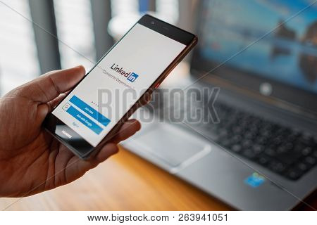 Chiang Mai, Thailand - July 13,2018: Man Holding Huawei Mobile Phone With Linkedin Application On Th