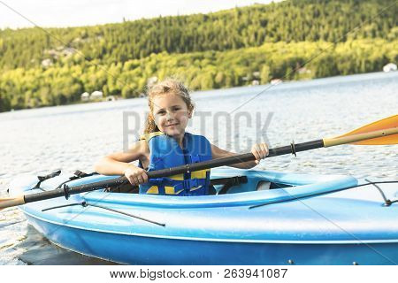 Summer Vacation Portrait Of Happy Cute Girl Kayaking The On River