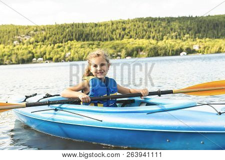 Summer Vacation Portrait Of Happy Cute Girl Kayaking The On River