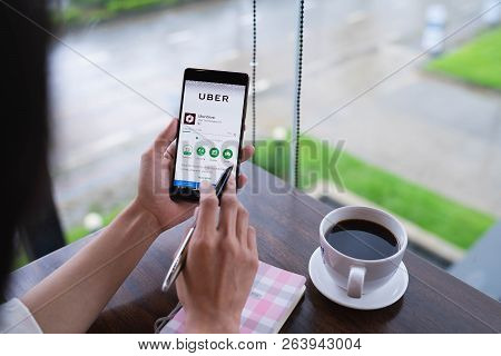 Chiang Mai, Thailand - August 18,2018: Woman Holding Huawei With Uber Apps. Uber Is Smartphone App T