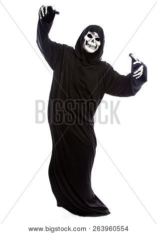 The Grim Reaper Or Death Halloween Costume Isolated On A White Background.  The Skeleton Is Wearing 