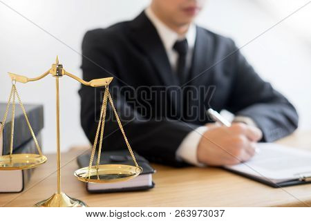 Tribunal Attorney Lawyer Working With Documents And Wooden Gavel On Tabel In Courtroom. Justice Advi