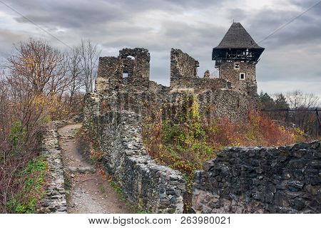 Ruins Of Nevytsky Castle Of Transcarpathia On A Gloomy November Day. Popular Tourist Destination Of 