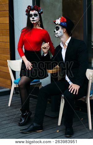 A Couple, Wearing Skull Make-up For. All Souls Day. Boy And Girl Sugar Skull Makeup.painted For Hall