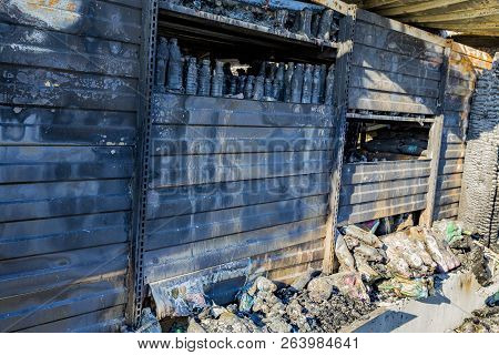 Damaged Industry Supermarket Metallic Facade After Arson Fire With Burnt Debris After Intense Burnin