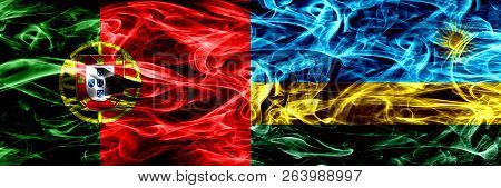 Portugal Vs Rwanda, Rwandan Smoke Flags Placed Side By Side. Thick Colored Silky Smoke Flags Of Port