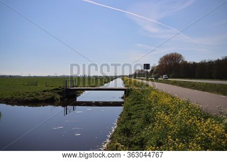 Ditch With Water In The Krimpenerwaard Area Between The Meadows Along Road N210 At Krimpen Aan Den I