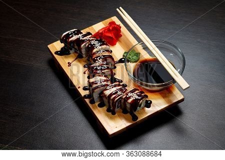 Tasty And Delicious Hot And Cold Sushi Rolls On The Table. Different Sushi - Rolls With Sauce On The