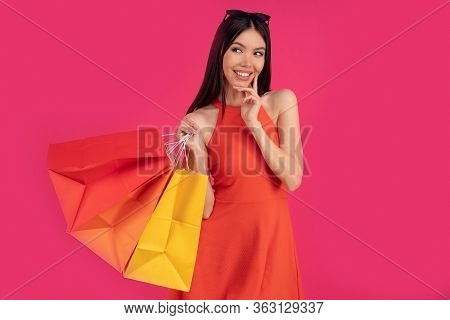Image Of A Beautiful Excited Happy Asian Woman Posing Isolated Over Pink Wall Background Holding Sho