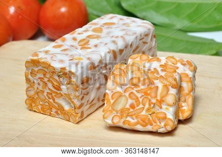 Slice Of Tempeh On Table, Tempeh Is Traditional Food From Indonesia.