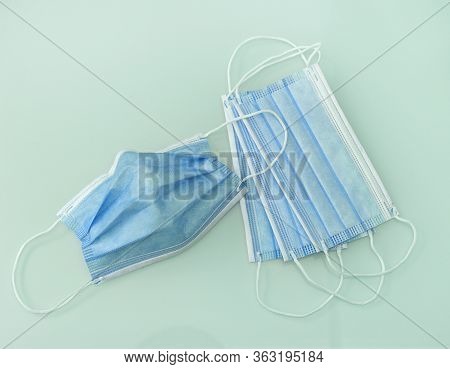 Blue Medical Doctor Face Masks Photo. Surgical Earloop Mask For Disease Prevention.