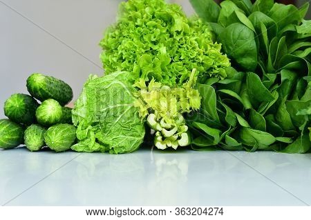 Juicy Fresh Spinach, Arugula ,lettuce Salad,cabbage,cucumbers On A White Background.fresh Organic Ra